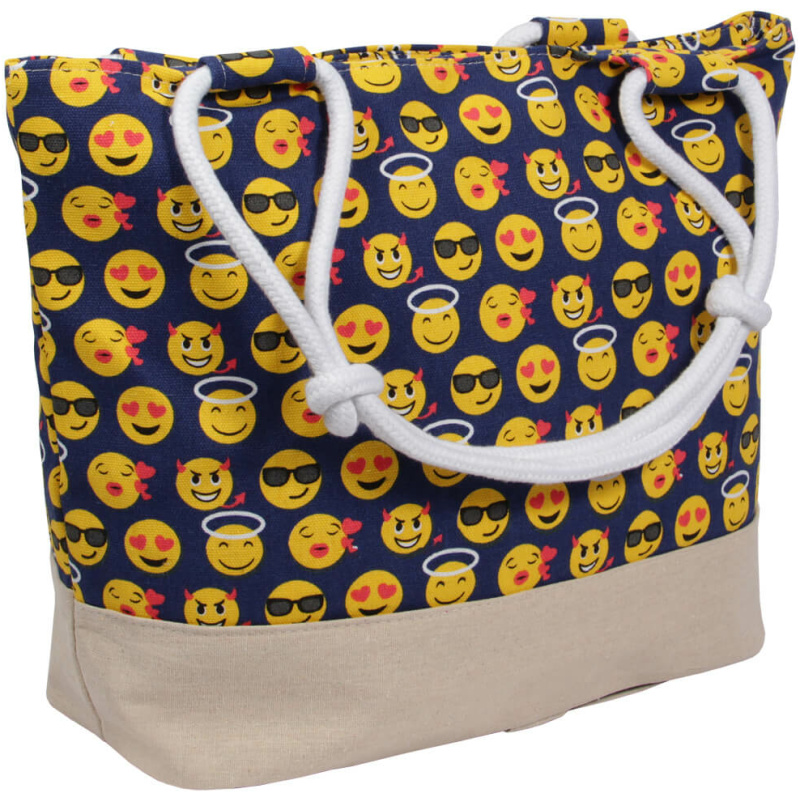 Eine farbenfrohe Einkaufstasche Strandtasche blau Emoticon ca. 48 cm x 35 cm mit einem Muster aus verschiedenen gelben Emojis, darunter welche mit Sonnenbrillen, Heiligenscheinen, Herzen und verschiedenen Ausdrücken auf dunkelblauem Hintergrund. Die Tasche hat einen beigen Boden und weiße Seilgriffe.